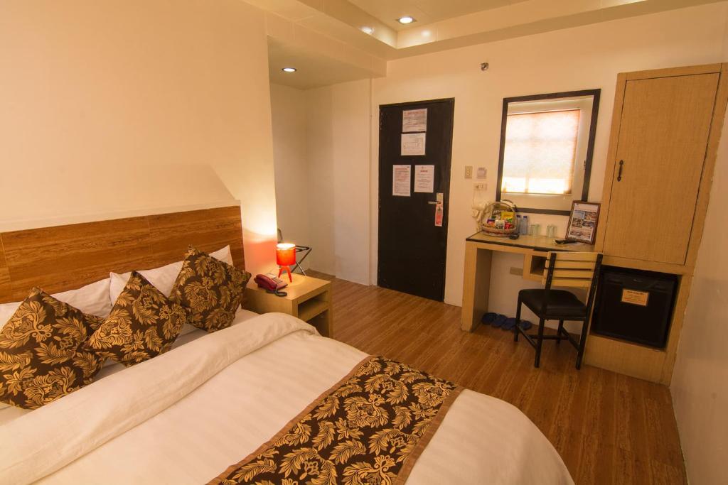 Postel nebo postele na pokoji v ubytování Hotel Carmelita
