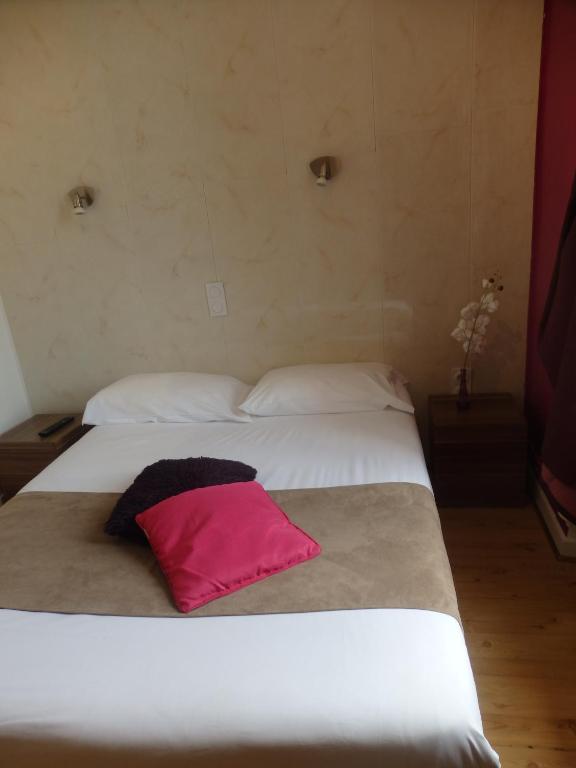 Postel nebo postele na pokoji v ubytování le relais des forêts