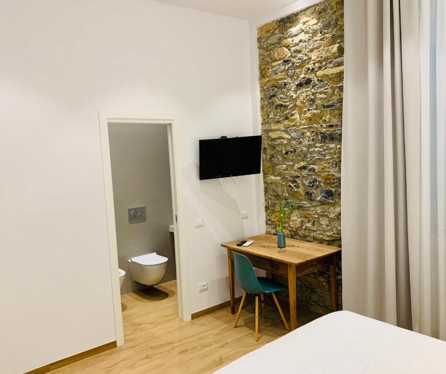 TV a/nebo společenská místnost v ubytování A Ca' De Mananan Guesthouse