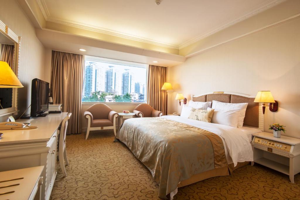 Postel nebo postele na pokoji v ubytování Panyu Hotel