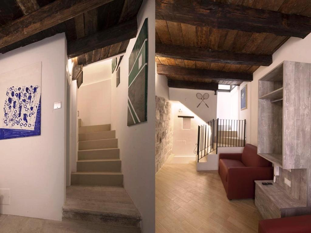 a hallway with a staircase and a living room at Residenze Portacastello in Isernia