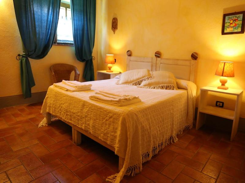 Postel nebo postele na pokoji v ubytování Agriturismo Borgo Santa Maria