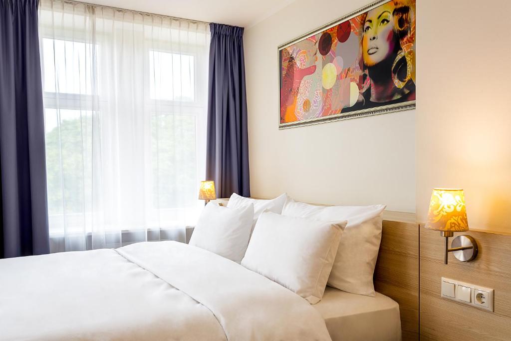 Postel nebo postele na pokoji v ubytování Radisson Hotel Old Town Riga