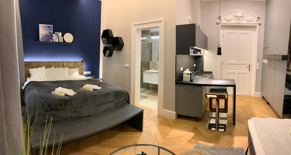 Letto o letti in una camera di Holec Apartments