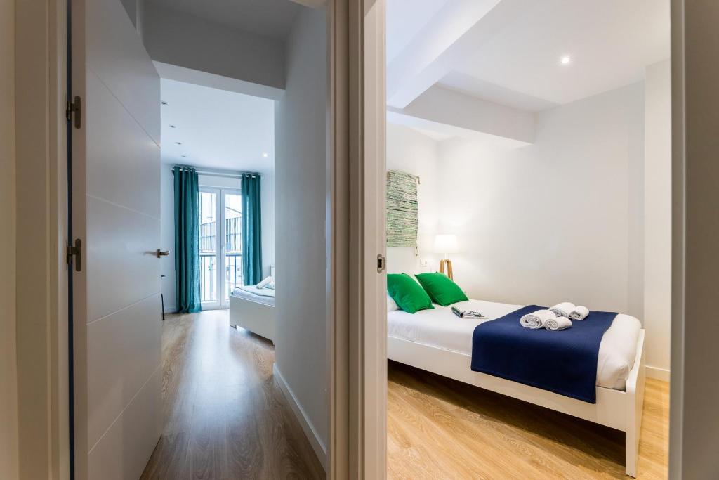 Posteľ alebo postele v izbe v ubytovaní MARINA by SWEET HOME SAN SEBASTIAN