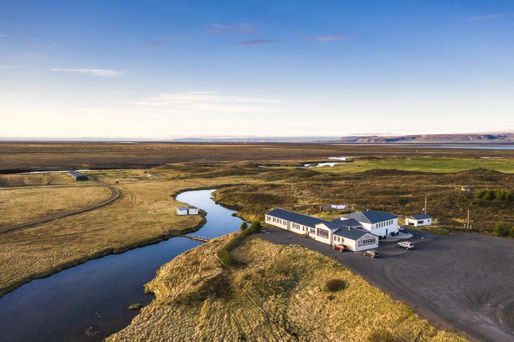 an aerial view of a campground next to a river at Skulagardur in Garður
