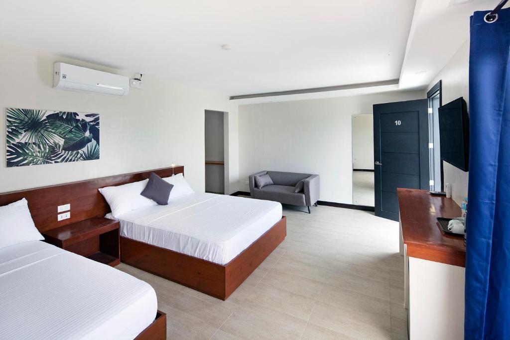 Postel nebo postele na pokoji v ubytování OHANA, Panglao Resort.