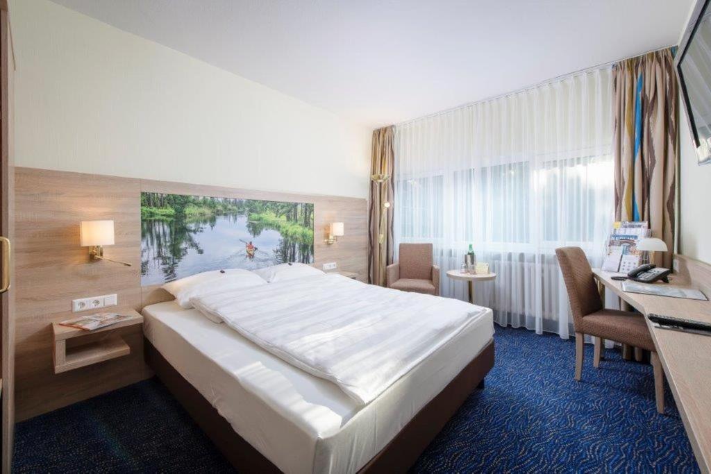Postel nebo postele na pokoji v ubytování Seehotel Grunewald