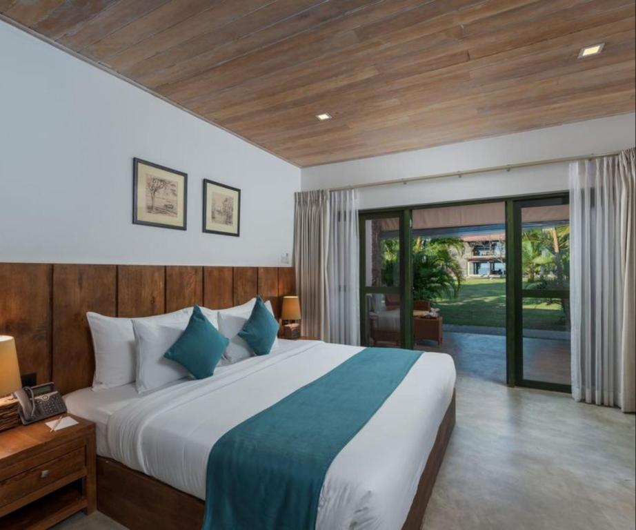 Postel nebo postele na pokoji v ubytování Regenta Arie Lagoon Negombo