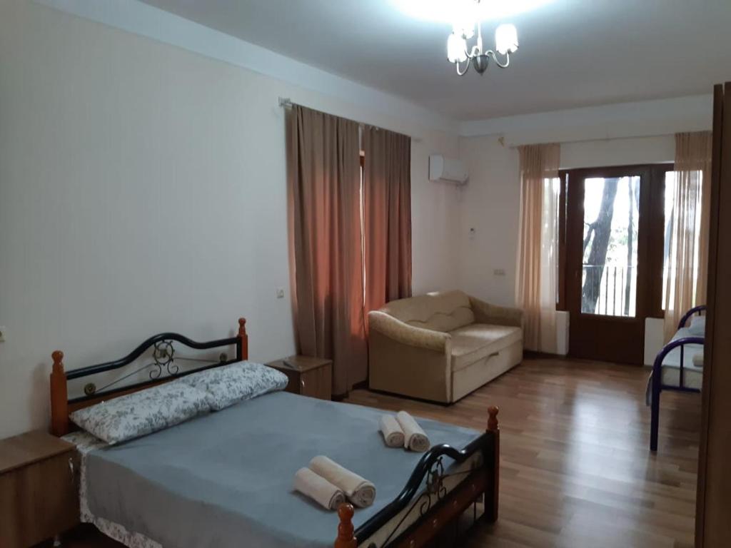 Postel nebo postele na pokoji v ubytování Hotel Niko