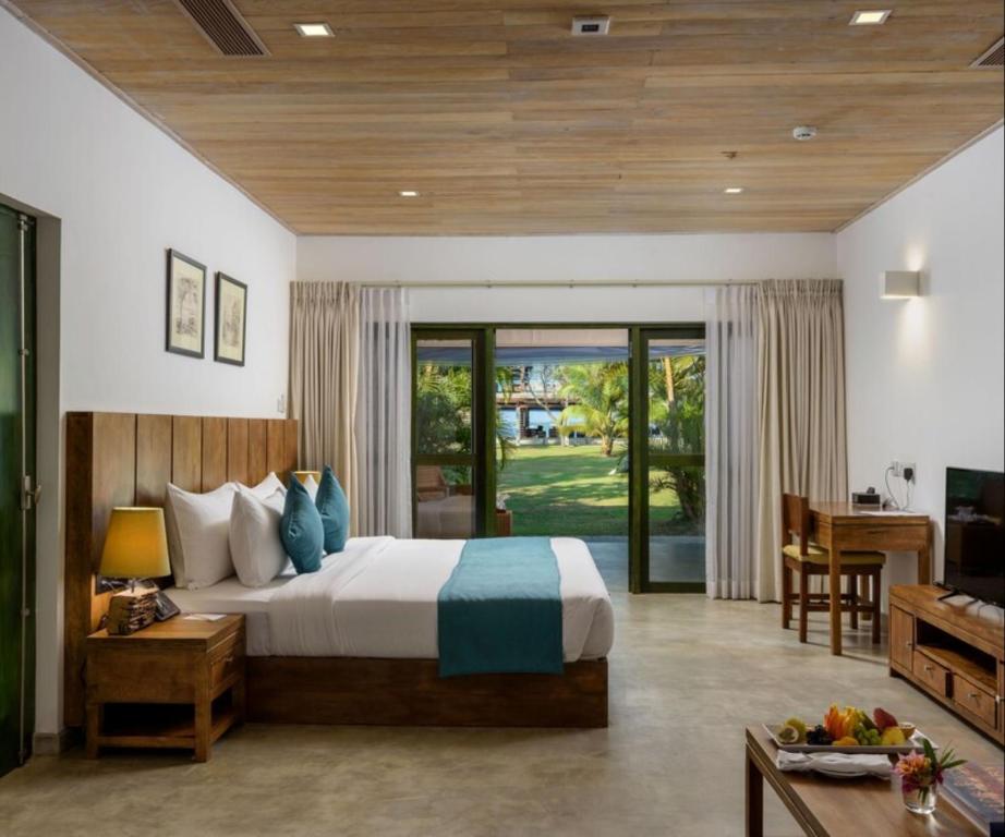 Postel nebo postele na pokoji v ubytování Regenta Arie Lagoon Negombo