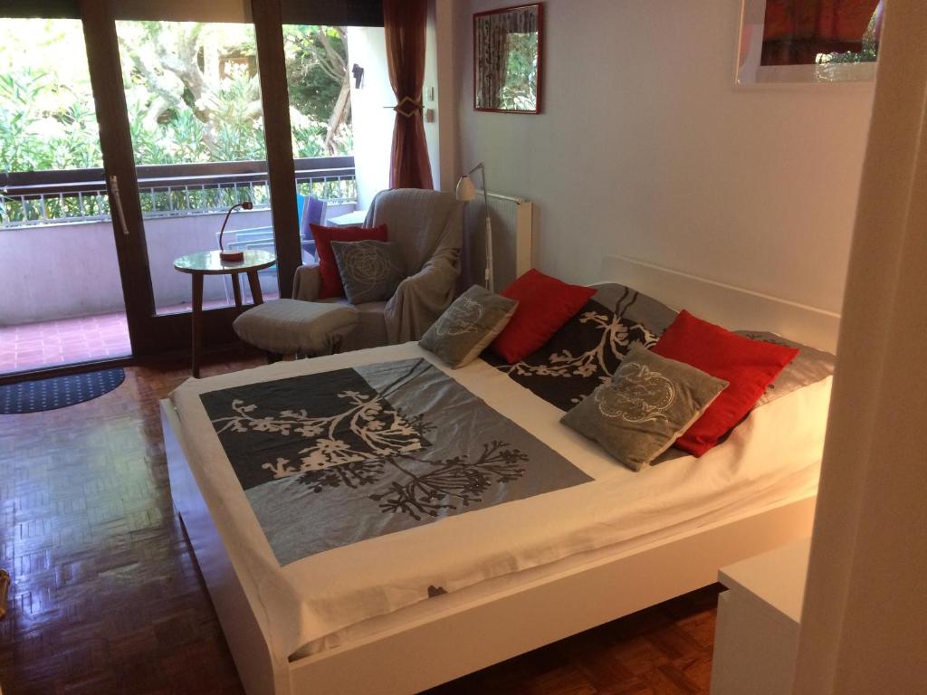 a bedroom with a bed with pillows on it at Apartment Les Muriers Blancs in Aix-en-Provence