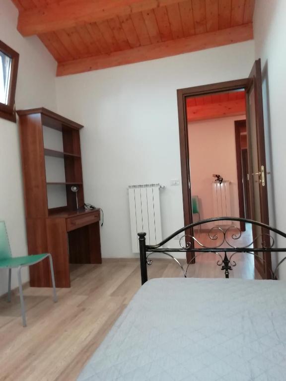 a bedroom with a bed and a mirror at B&B Belle Donne in Palazzo San Gervasio