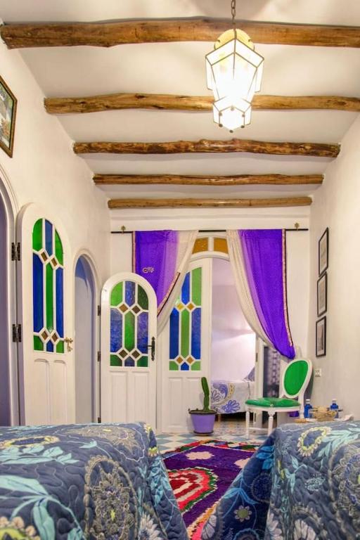 Postel nebo postele na pokoji v ubytování Afra House