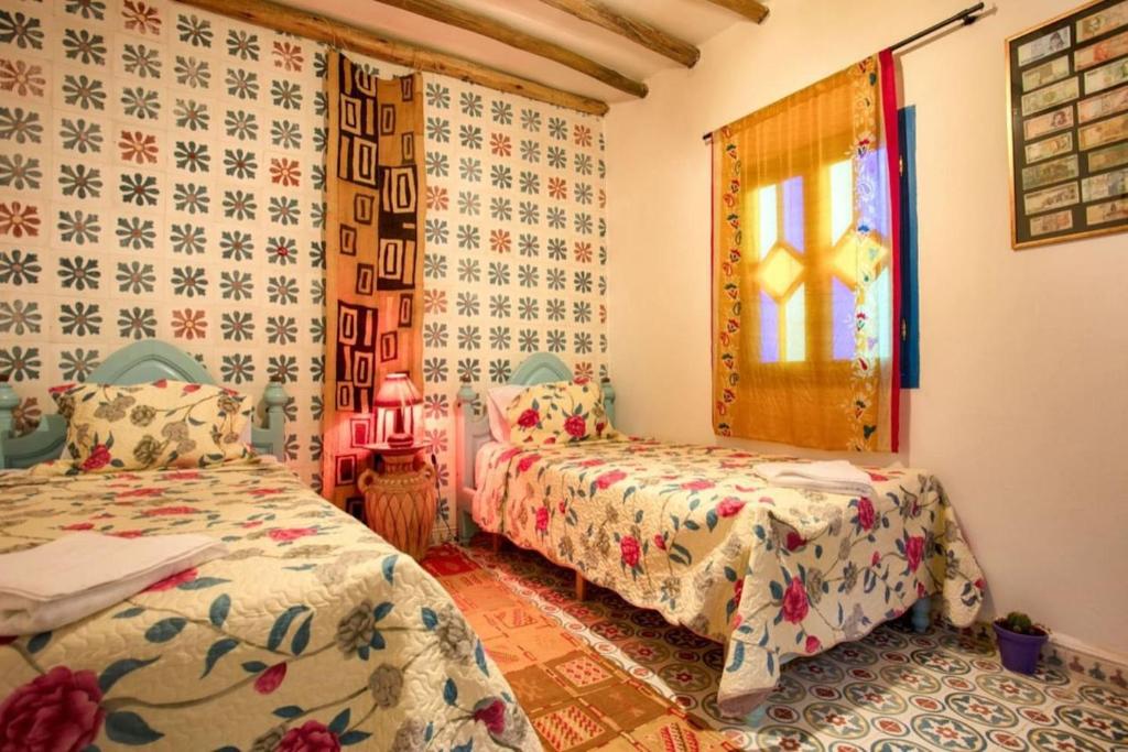 Postel nebo postele na pokoji v ubytování Afra House