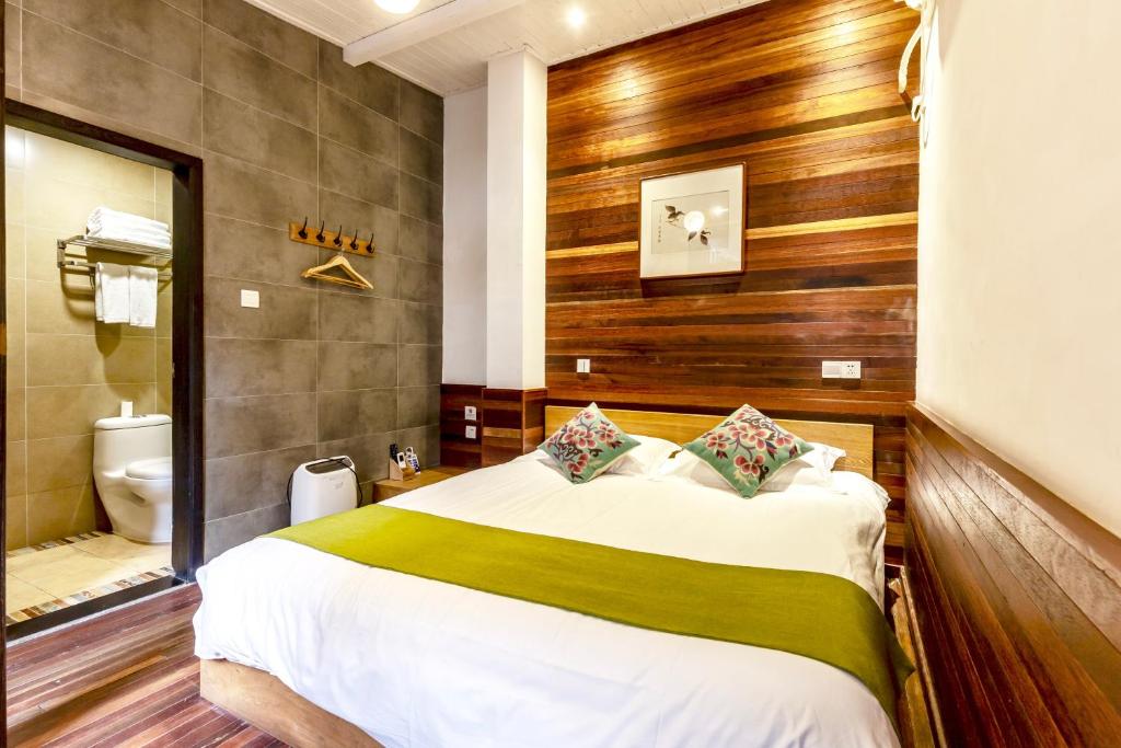 Postel nebo postele na pokoji v ubytování Hofang Guest House