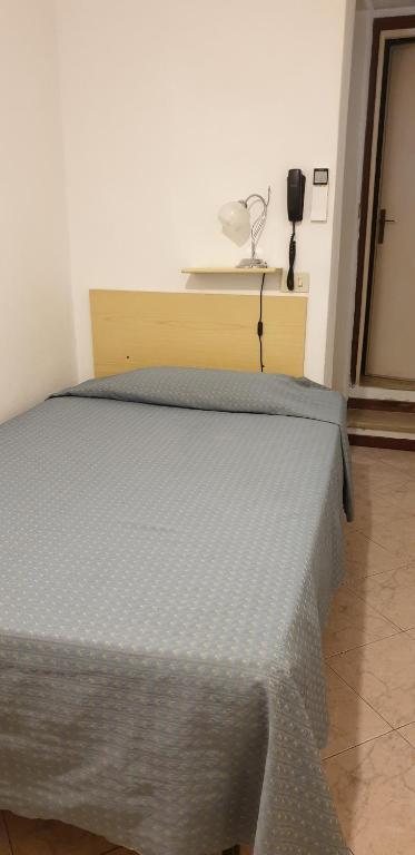 Postel nebo postele na pokoji v ubytování Hotel Anselmi