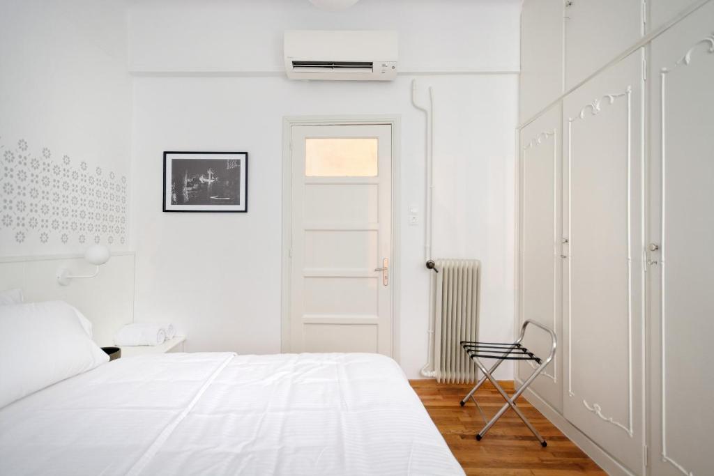 Posteľ alebo postele v izbe v ubytovaní Art in Athens Suite