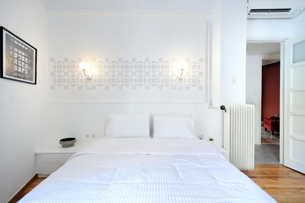 Posteľ alebo postele v izbe v ubytovaní Art in Athens Suite