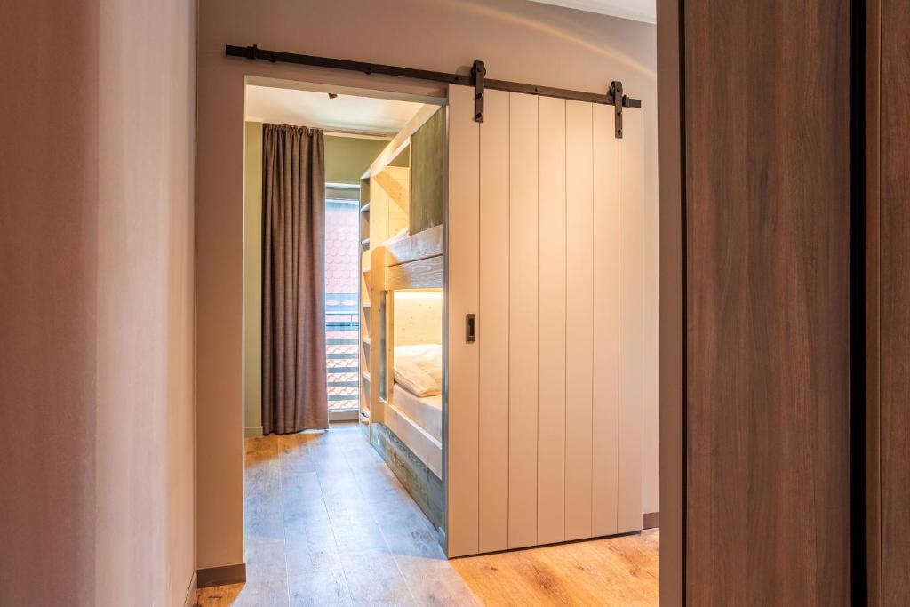 Postel nebo postele na pokoji v ubytování EchtZeit - Dein Hotelquartier