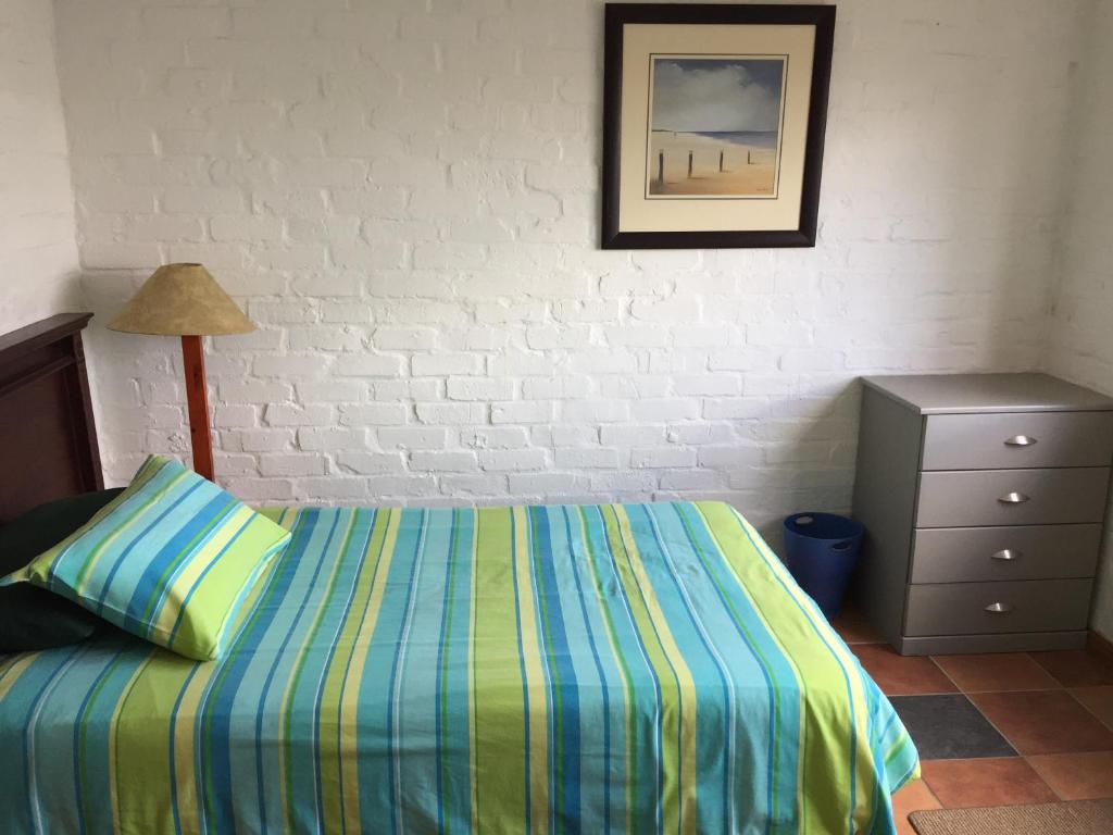 Ein Bett oder Betten in einem Zimmer der Unterkunft Net Net Holiday Home