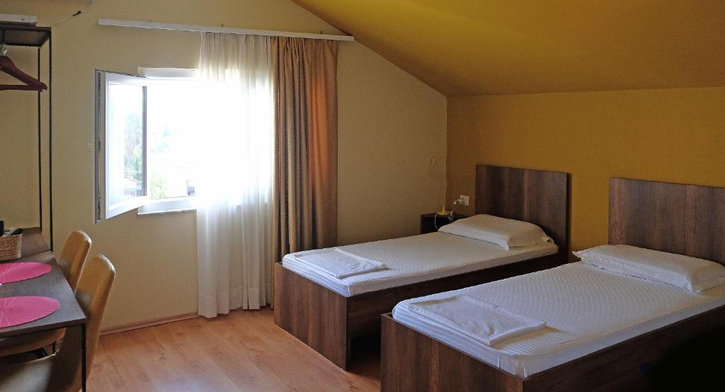 Postel nebo postele na pokoji v ubytování Friends Terrace
