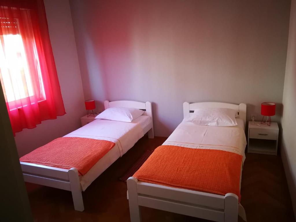 Cama ou camas em um quarto em Apartman Buky