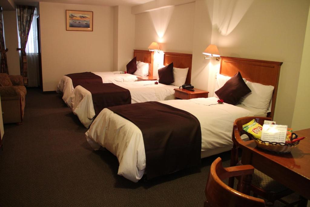 Cama o camas de una habitación en Casona Plaza Hotel Puno