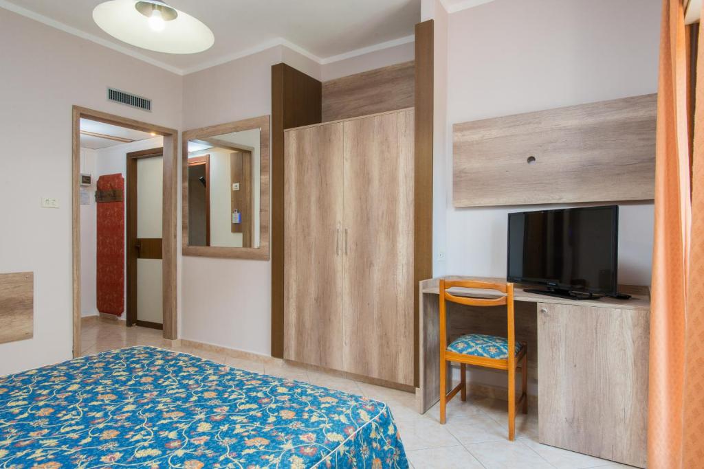 Postel nebo postele na pokoji v ubytování Hotel Tasso
