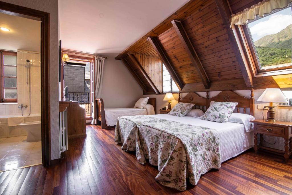 Postel nebo postele na pokoji v ubytování Hotel Fonfreda