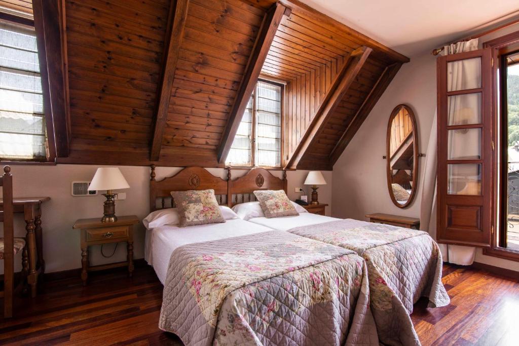 Postel nebo postele na pokoji v ubytování Hotel Fonfreda