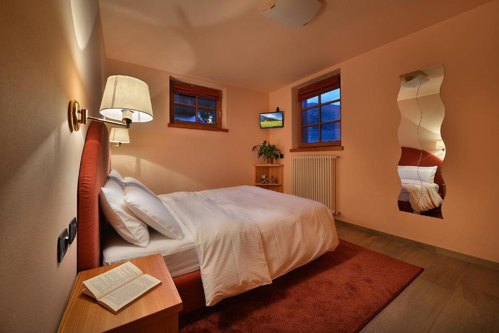 Postel nebo postele na pokoji v ubytování Chalet Matteo