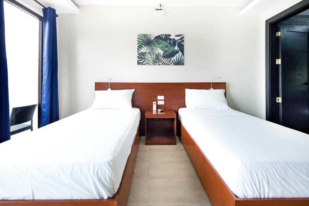 Postel nebo postele na pokoji v ubytování OHANA, Panglao Resort.