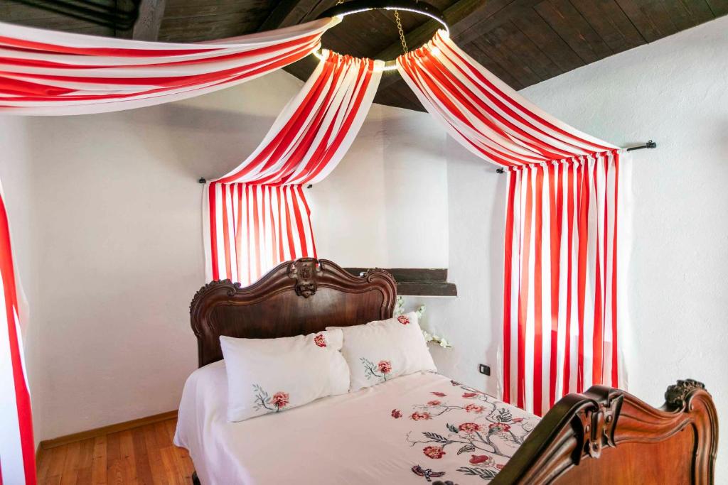 Postel nebo postele na pokoji v ubytování Agriturismo Famiglia al Castello Di Bagnolo