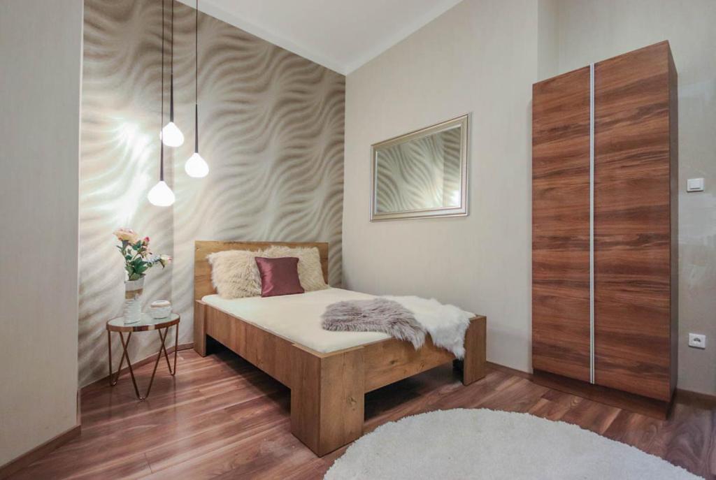 Posteľ alebo postele v izbe v ubytovaní Bengt Apartment Dohány Str.