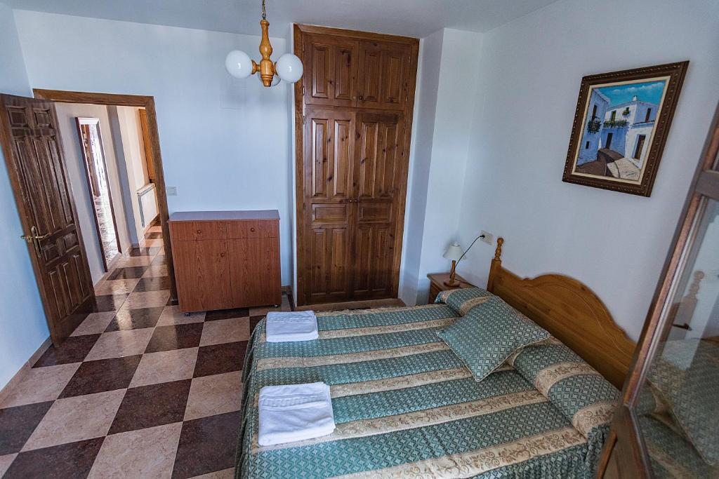 Cama o camas de una habitación en Apartamentos Rurales Las Chimeneas