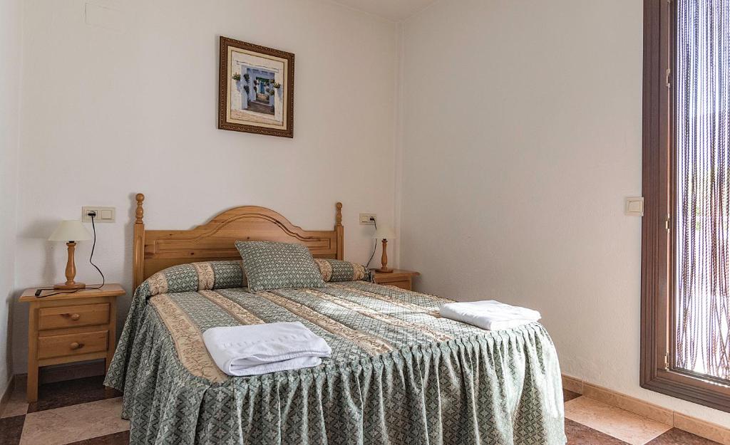 Cama o camas de una habitación en Apartamentos Rurales Las Chimeneas