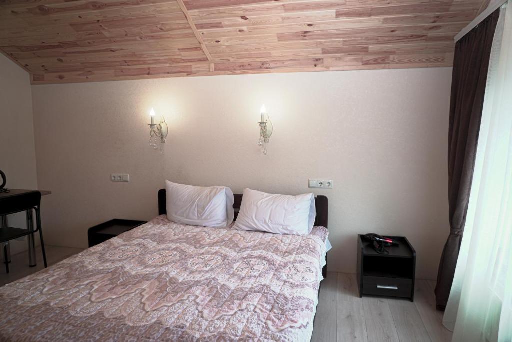 Postel nebo postele na pokoji v ubytování ARKADIYA HOUSE