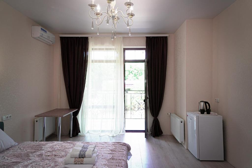 Postel nebo postele na pokoji v ubytování ARKADIYA HOUSE