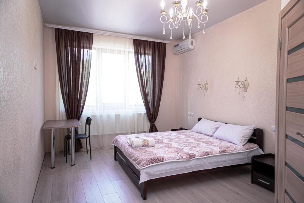 Postel nebo postele na pokoji v ubytování ARKADIYA HOUSE