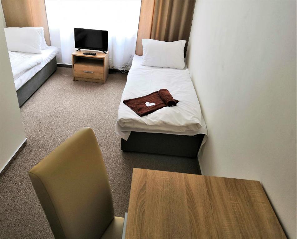 Postel nebo postele na pokoji v ubytování Hotel Marianeum