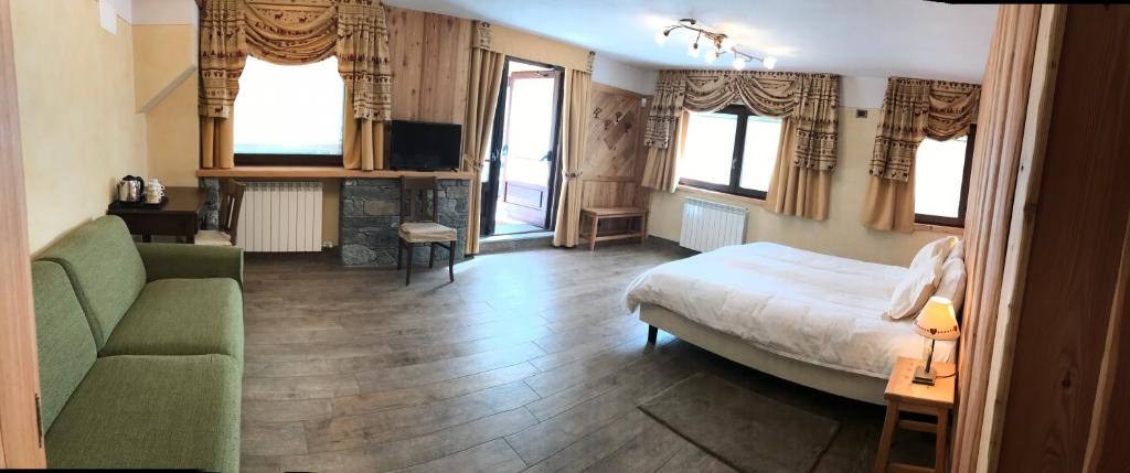 Postel nebo postele na pokoji v ubytování Hotel L' Aiglon