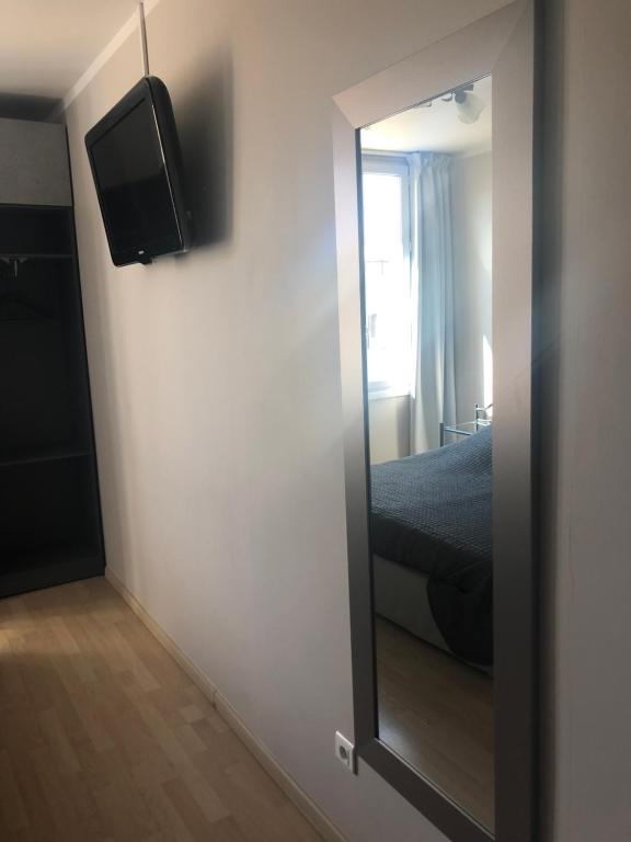 Postel nebo postele na pokoji v ubytování Hôtel Le Lys d'Or