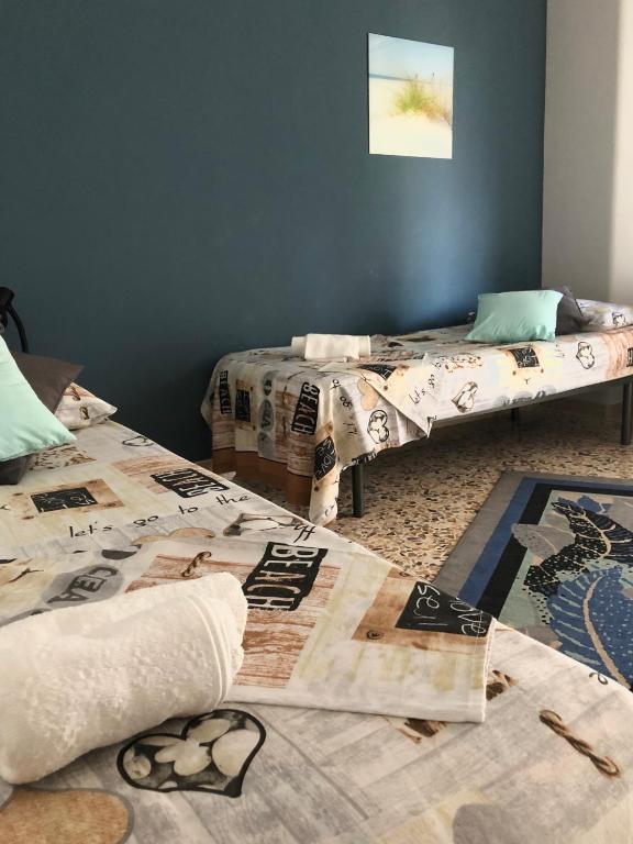 Łóżko lub łóżka w pokoju w obiekcie Casa Aurora