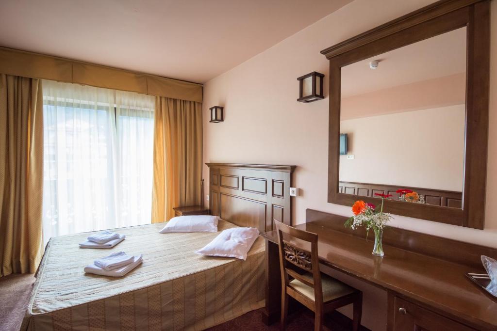 Postel nebo postele na pokoji v ubytování Hanul Bran