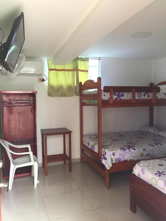 Postel nebo postele na pokoji v ubytování Hostal Sarai