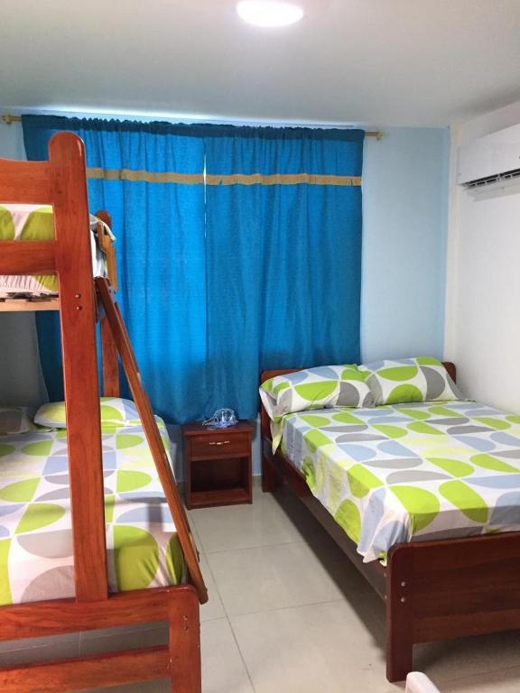 Postel nebo postele na pokoji v ubytování Hostal Sarai