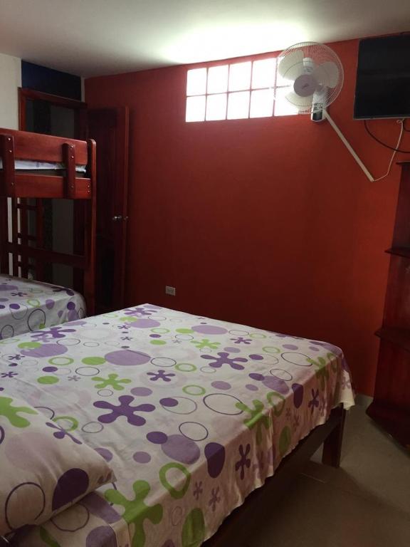 Postel nebo postele na pokoji v ubytování Hostal Sarai
