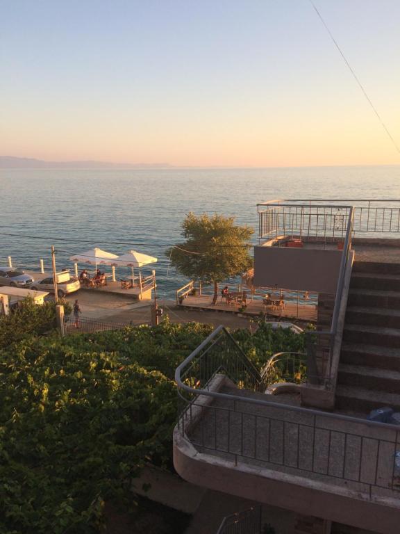 a view of the ocean from a resort with stairs at Borsh Beach Apartments - BBA in Borsh