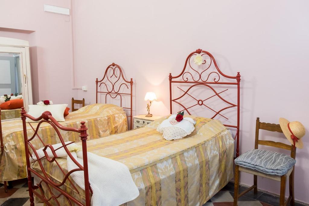 Łóżko lub łóżka w pokoju w obiekcie Villa Rambaudi
